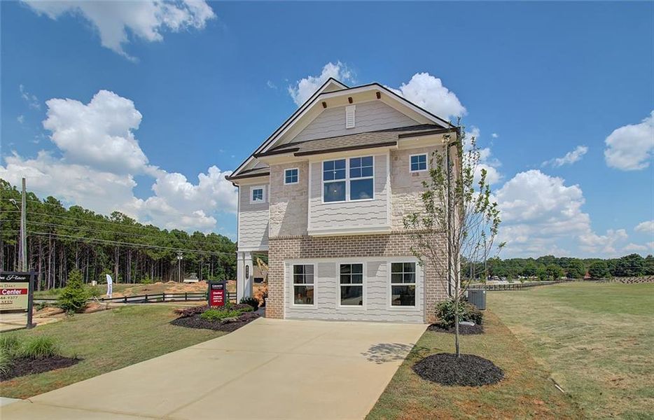 Front exterior of a new home in Crofton Place Enclave, Snellville, GA, highlighting curb appeal (Image 26).