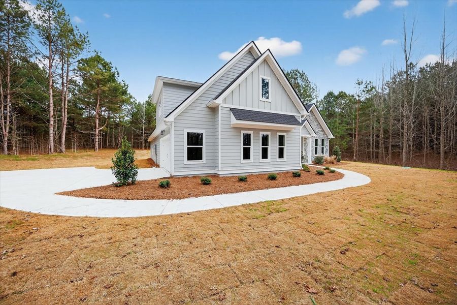 Front exterior of a new home in White Oaks, The Rock, GA, highlighting curb appeal (Image 24). Front exterior of a new home in White Oaks, The Rock, GA, highlighting curb appeal (Image 24).