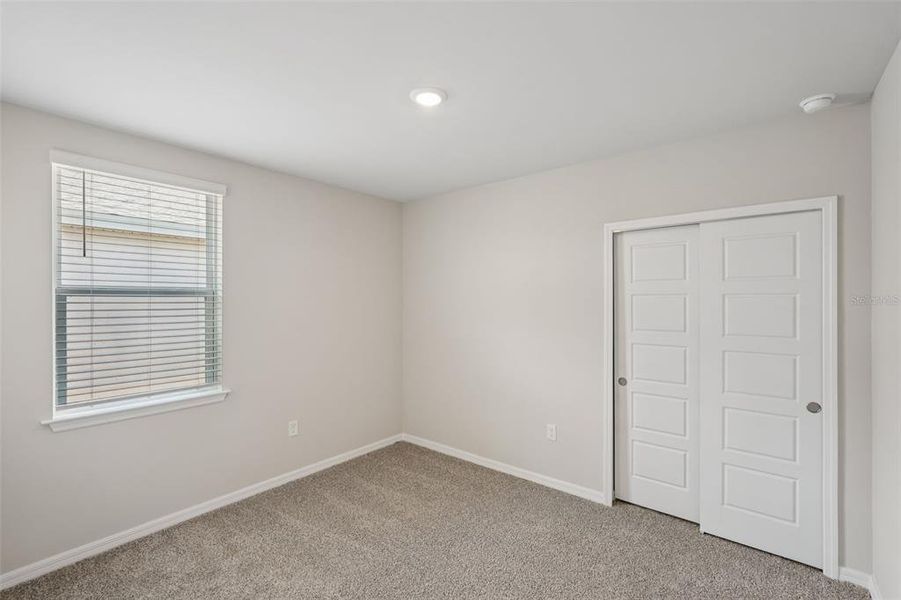 Spacious, unfurnished interior of a new home in Crescent Lakes - Premier Series, Punta Gorda (Image 14).