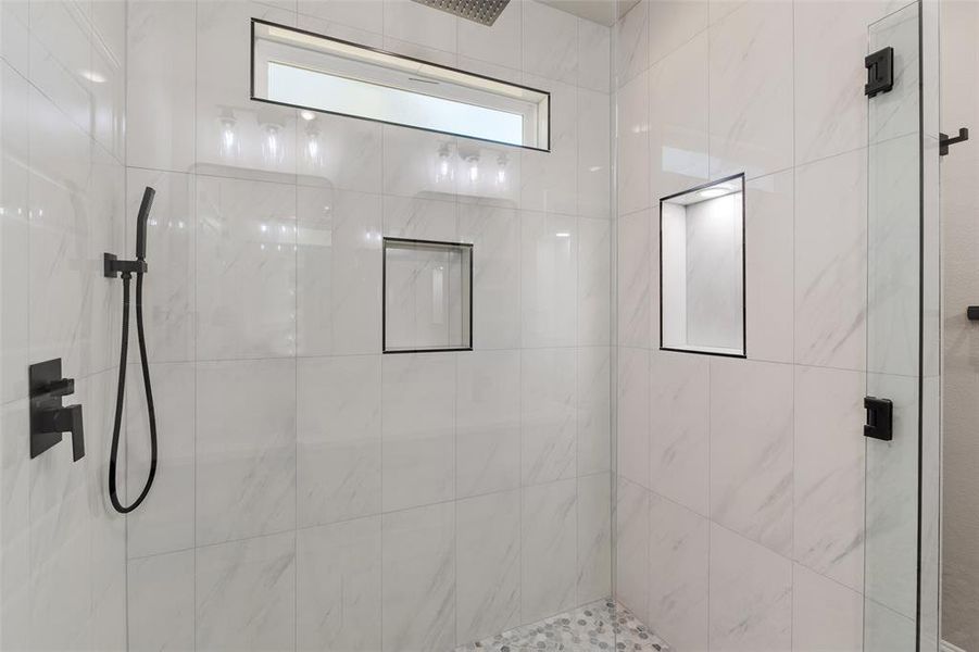 Bathroom featuring tiled shower