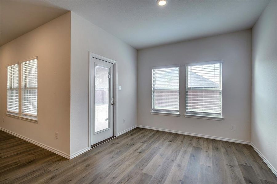 Entryway with light wood finished floors and baseboards