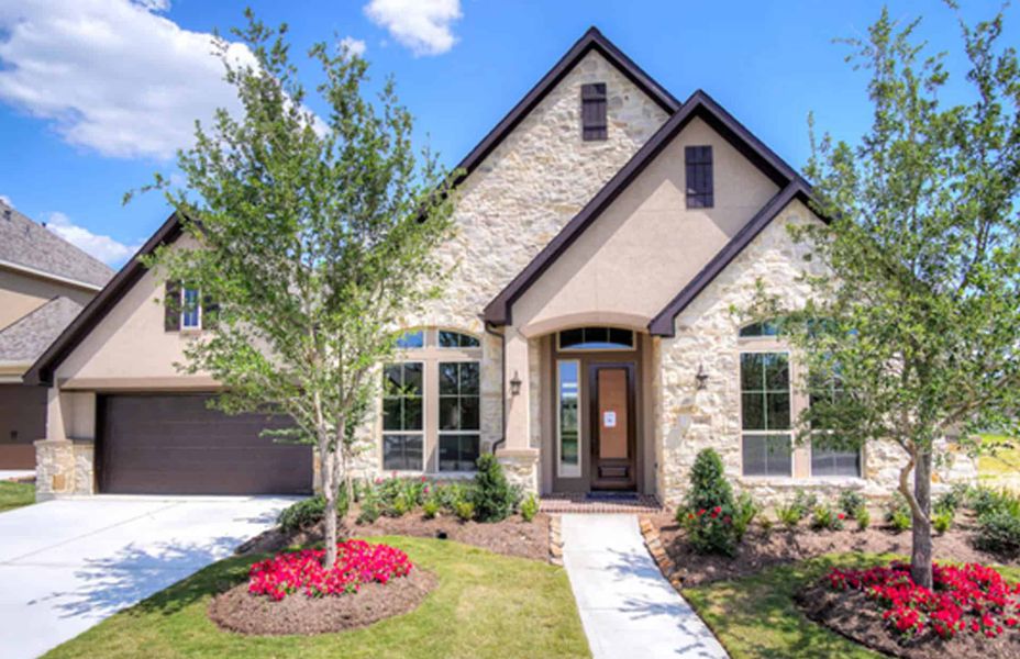 Representative exterior photo of a completed home built from the 4290 by Ravenna Homes in Artavia 70′, Conroe, TX (Image 21). Representative exterior photo of a completed home built from the 4290 by Ravenna Homes in Artavia 70′, Conroe, TX (Image 21).