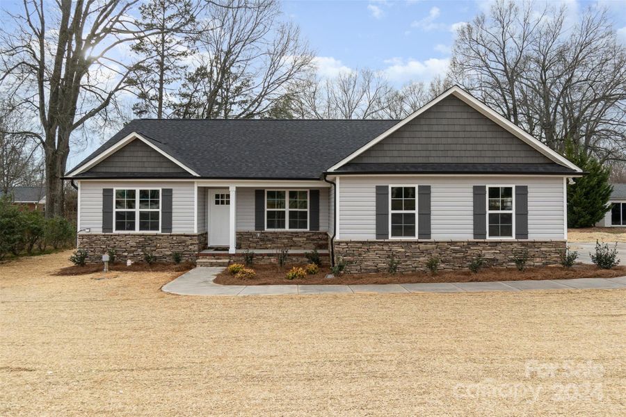 Beauty is in the Details. Home is nicely accented with Stone Veneer foundation and Vinyll Shake siding.