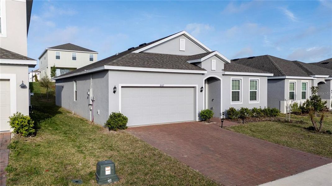 Front exterior of a new home in , Groveland, FL, highlighting curb appeal (Image 21).