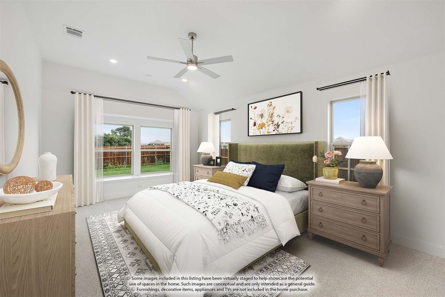 Bedroom with green upholstered headboard, ceiling fan, carpet flooring, and two windows with white curtains Bedroom with green upholstered headboard, ceiling fan, carpet flooring, and two windows with white curtains