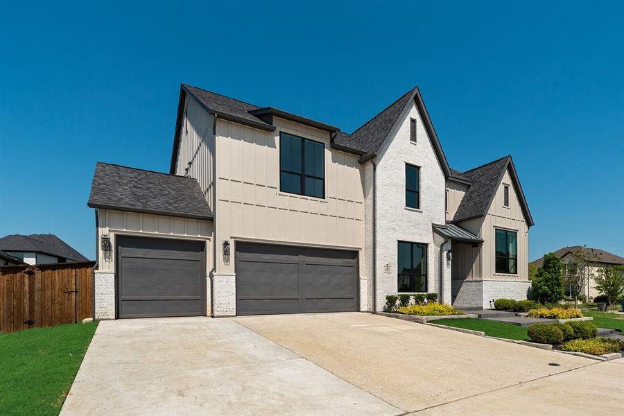 Front exterior of a new home in Light Farms Graham/Reagan, Celina, TX, highlighting curb appeal (Image 23).