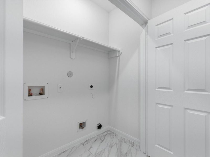 Thoughtfully positioned for daily ease, the utility room keeps routines efficient and organized.