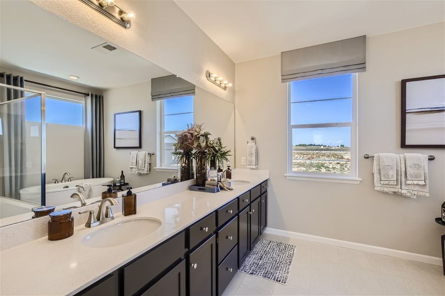 A bathroom with a large mirror. A bathroom with a large mirror.