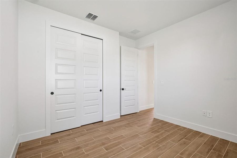 Spacious, unfurnished interior of a new home in Magnolia Bay - Reserve Series, Nokomis (Image 26).