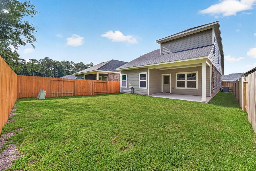 Exterior details and patio area of a home in Mill Creek Trails, Magnolia (Image 27).
