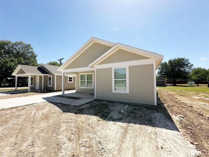 Front exterior of a new home in , Mineral Wells, TX, highlighting curb appeal (Image 14). Front exterior of a new home in , Mineral Wells, TX, highlighting curb appeal (Image 14).