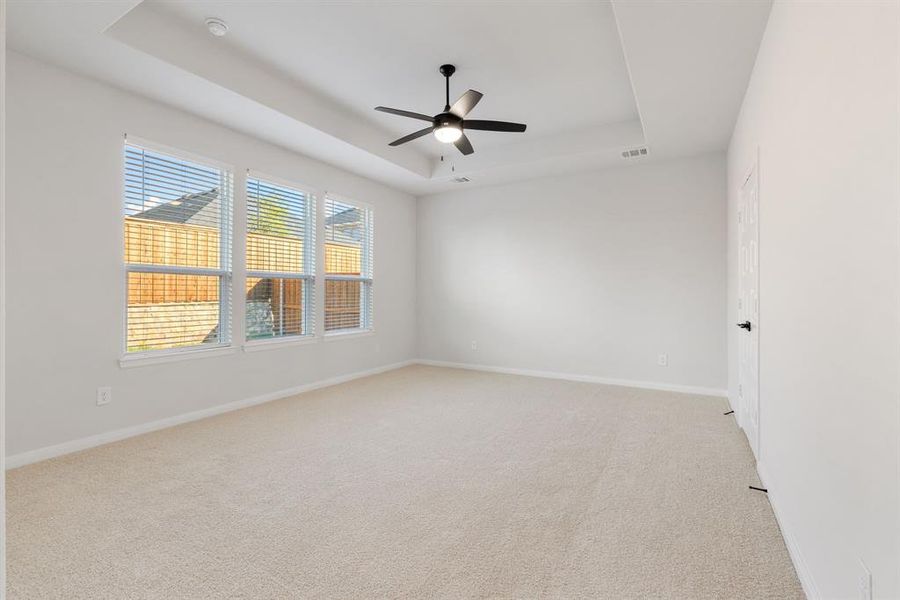 With high ceilings, oversized windows and plush carpeting, this owner's suite was designed for rest and relaxation.