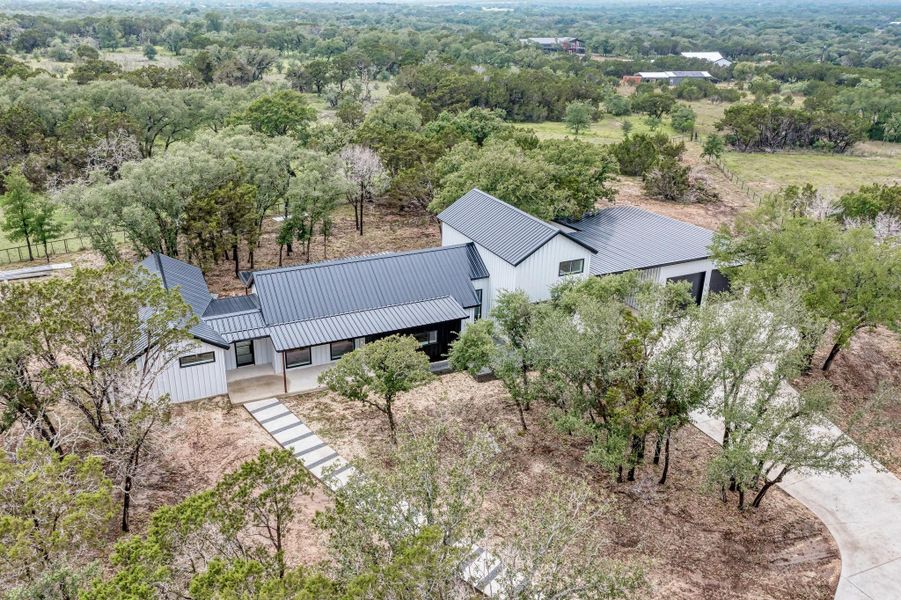 Aerial view of property, metal roof