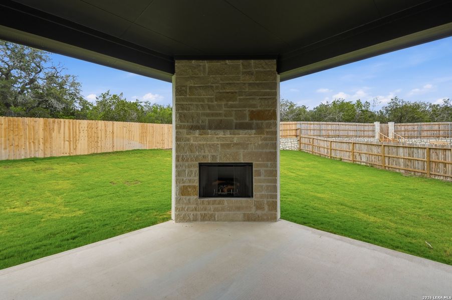 Exterior details and patio area of a home in The Reserve at Potranco Oaks, Castroville (Image 31).