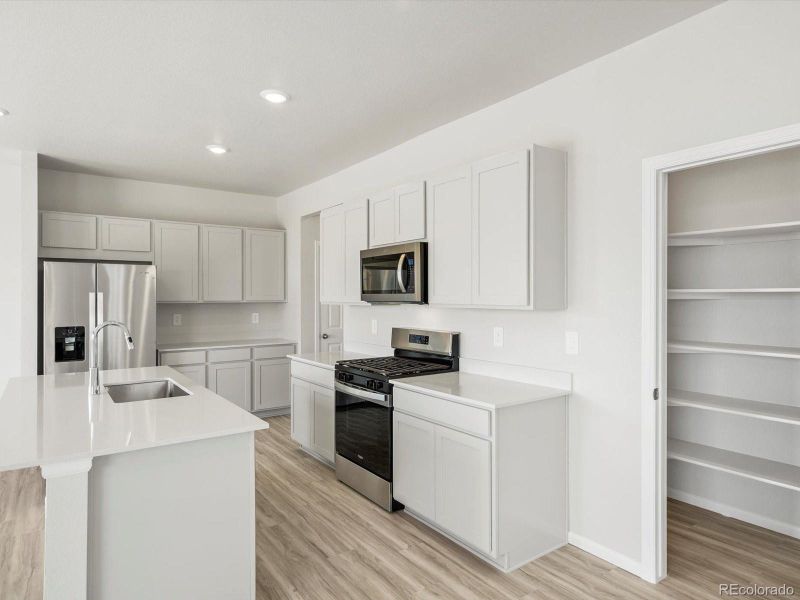 Furnished interior view inside a new home in Lake Bluff, Greeley (Image 6).