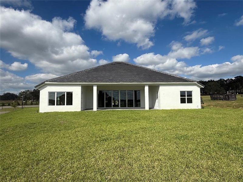 Exterior details and patio area of a home in West Hill Estates, Dade City (Image 3).