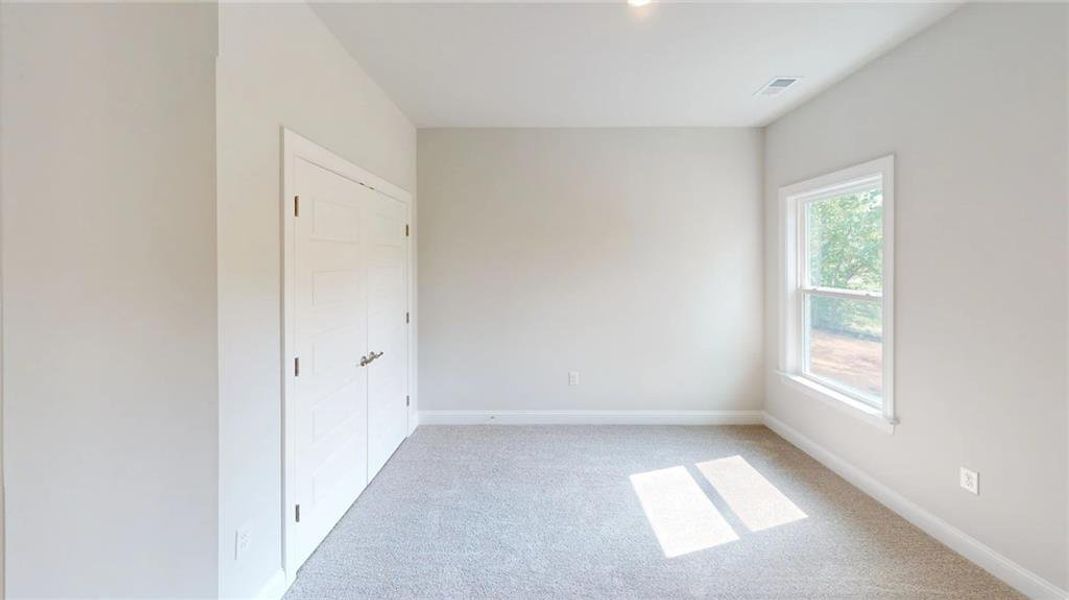 Spacious, unfurnished interior of a new home in Mirror Lake at South Harbour, Villa Rica (Image 17).