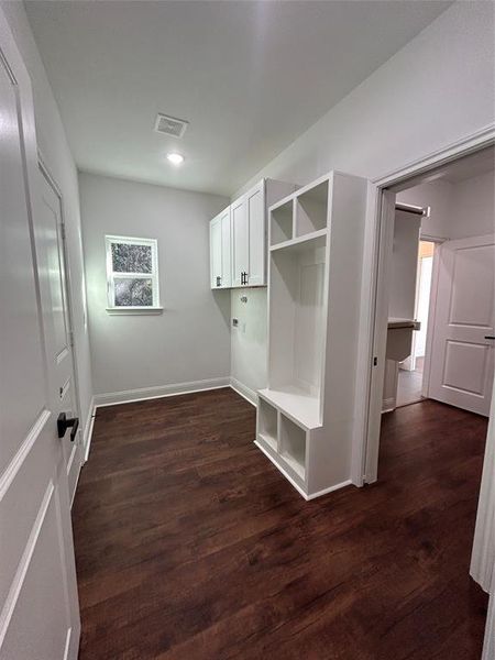 Laundry room next to master closet