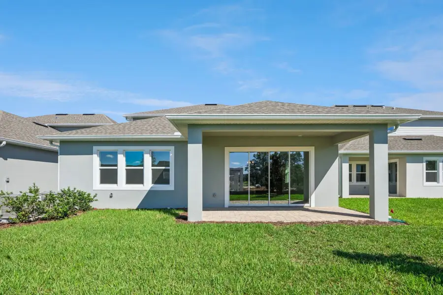 Exterior details and patio area of a home in Northlake at Ovation, Winter Garden (Image 22).