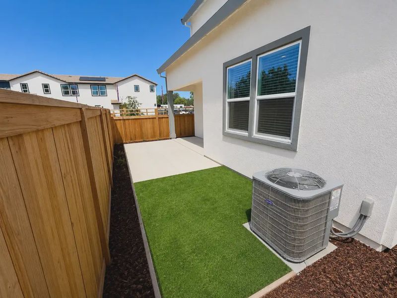A backyard with a basket and a basket on the side. A backyard with a basket and a basket on the side.