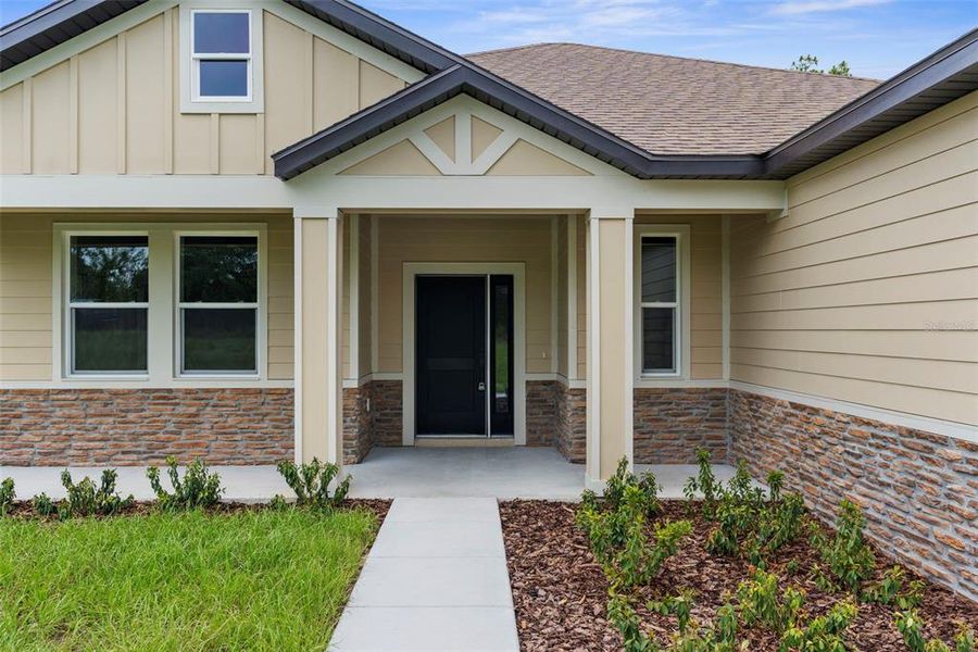 Front exterior of a new home in , Weeki Wachee, FL, highlighting curb appeal (Image 1).
