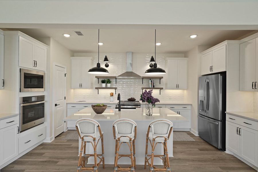 Kitchen with vast island & pendant lighting