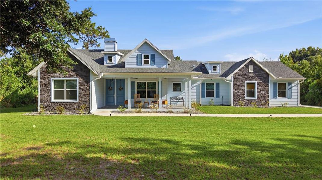 Front exterior of a new home in , Wesley Chapel, FL, highlighting curb appeal (Image 27). Front exterior of a new home in , Wesley Chapel, FL, highlighting curb appeal (Image 27).