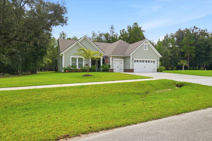 Front exterior of a new home in , Johns Island, SC, highlighting curb appeal (Image 21). Front exterior of a new home in , Johns Island, SC, highlighting curb appeal (Image 21).