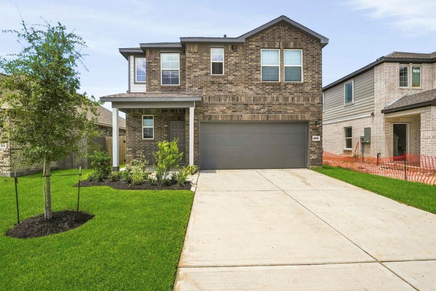 Front exterior of a new home in Riverwood Ranch, Angleton, TX, highlighting curb appeal (Image 1). Front exterior of a new home in Riverwood Ranch, Angleton, TX, highlighting curb appeal (Image 1).