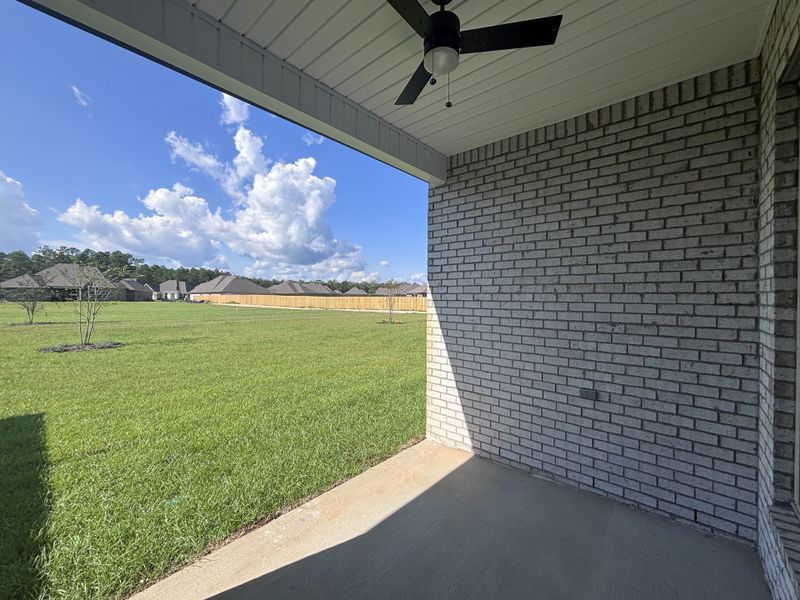 Exterior details and patio area of a home in Bird Song at Hammock Bay, Freeport (Image 3).