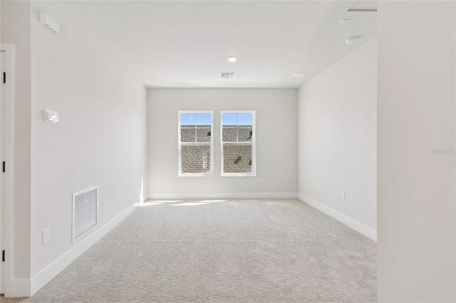 Spacious, unfurnished interior of a new home in Emerald Landing at Waterside at Lakewood Ranch – Cottage Series, Sarasota (Image 30).