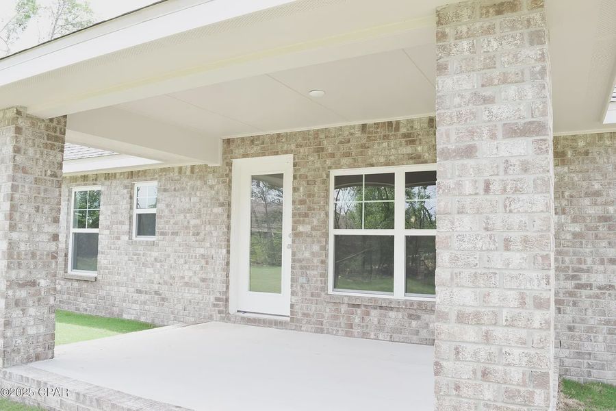 Exterior details and patio area of a home in Cedar Creek at Deerpoint Lake, Panama City (Image 2). Exterior details and patio area of a home in Cedar Creek at Deerpoint Lake, Panama City (Image 2).