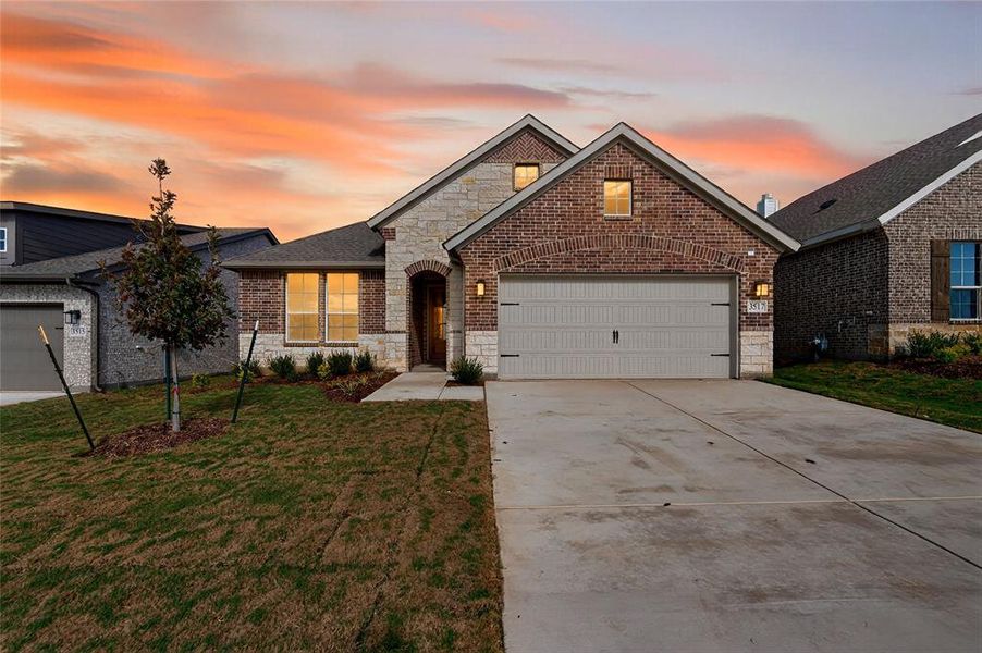 Front exterior of a new home in Liberty Pointe, Gainesville, TX, highlighting curb appeal (Image 1).