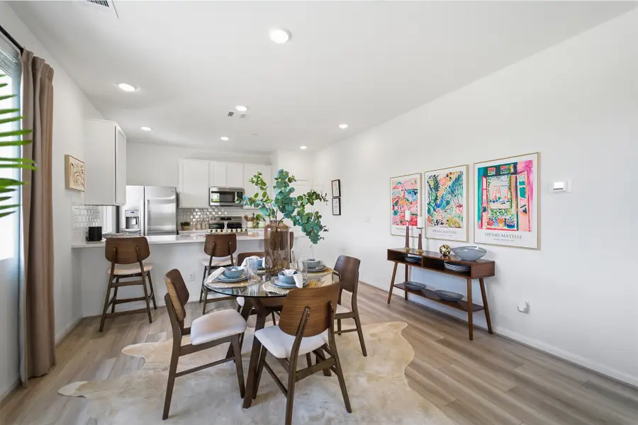 Representative furnished interior of a home built from the Kahn by CastleRock Communities in Municipal Drive Townhomes, Leander (Image 11).