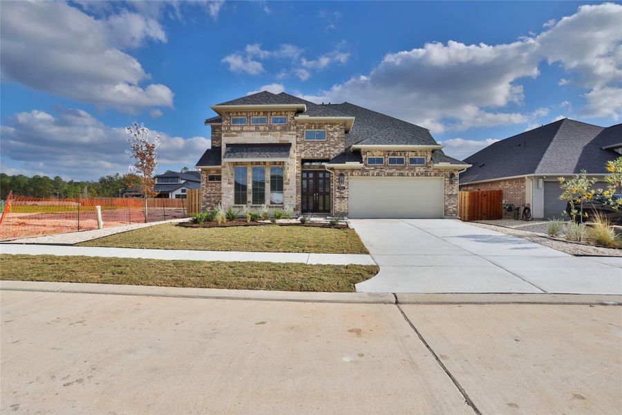 Front exterior of a new home in Colton 55', Montgomery, TX, highlighting curb appeal (Image 19).