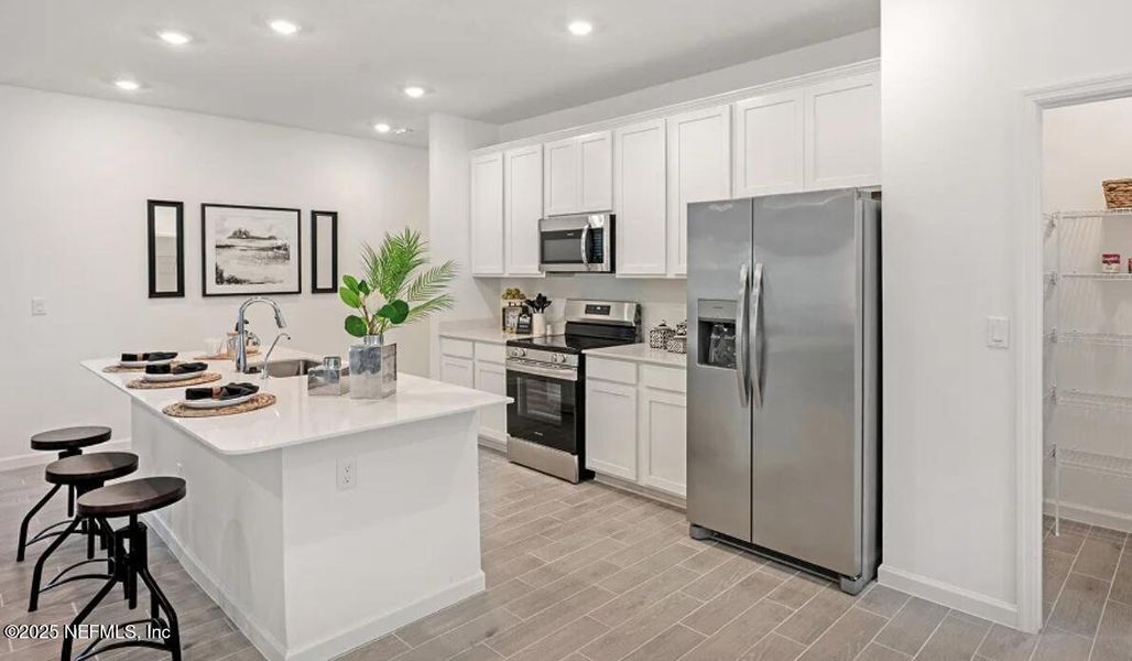 Furnished interior view inside a new home in Tributary: Tributary Royal Collection, Yulee (Image 6).