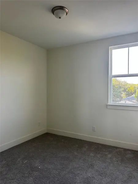 Spare room with dark colored carpet Spare room with dark colored carpet