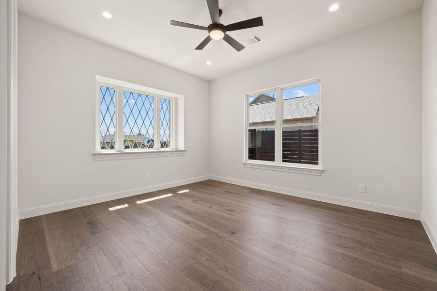 Empty room with wood-style floors, recessed lighting, and a ceiling fan