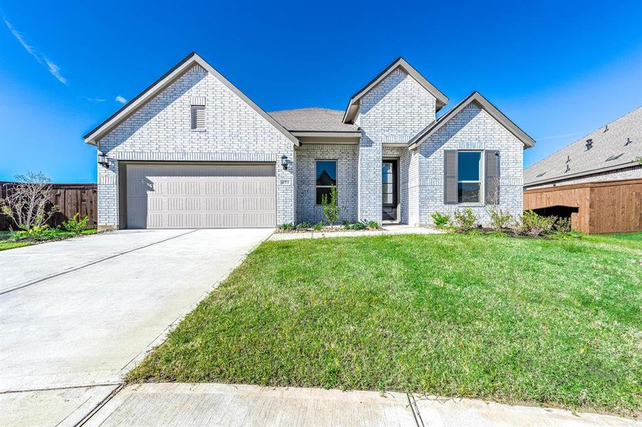 Welcome home! This modern, brick-exterior beauty is full of charm and curb appeal. A spacious driveway and meticulously landscaped yard make the perfect first impression!