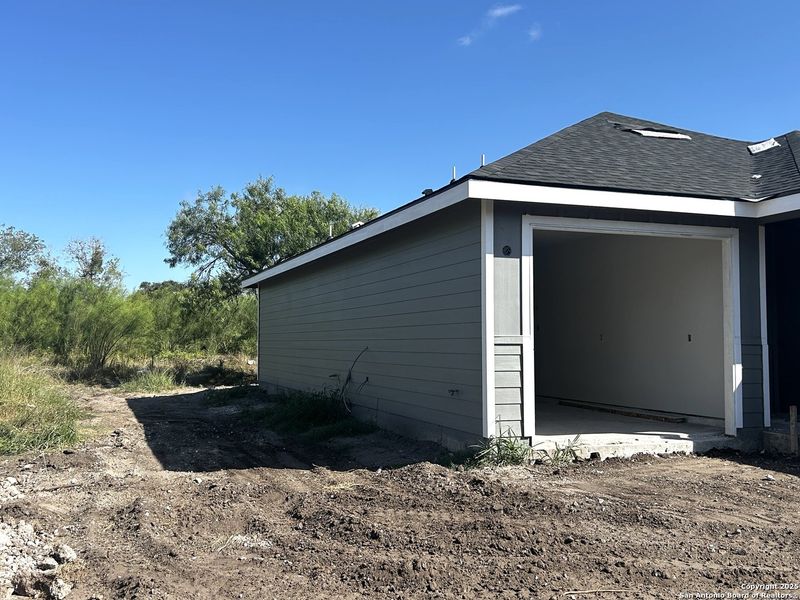 Front exterior of a new home in , Beeville, TX, highlighting curb appeal (Image 1).