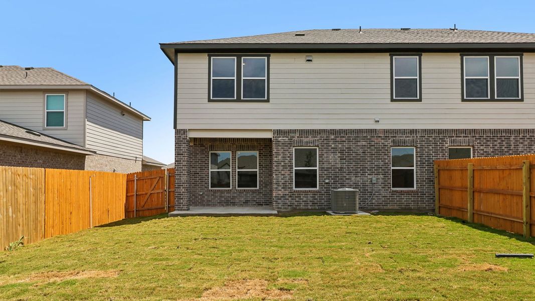 Exterior details and patio area of a home in Palomino, Manor (Image 21).