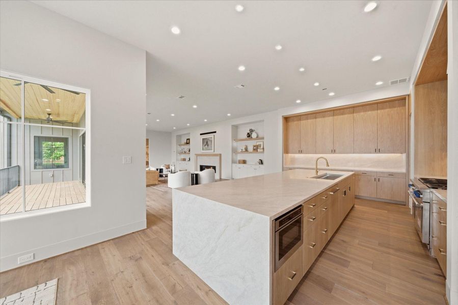 Open-concept kitchen overlooking the main living area for effortless entertaining and everyday living.