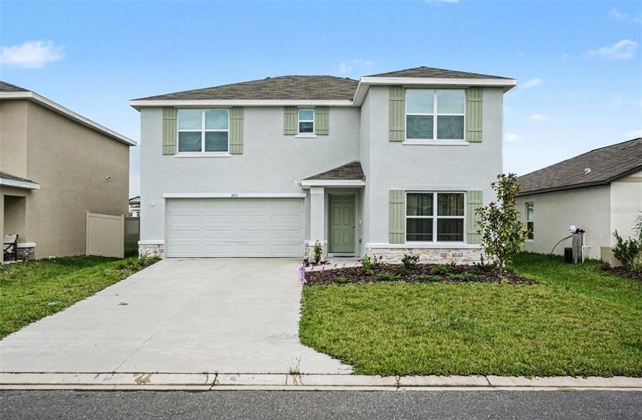 Front exterior of a new home in , Plant City, FL, highlighting curb appeal (Image 1). Front exterior of a new home in , Plant City, FL, highlighting curb appeal (Image 1).