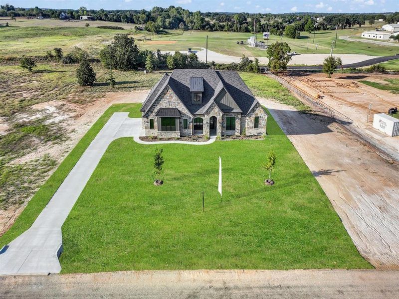 Front exterior of a new home in , Weatherford, TX, highlighting curb appeal (Image 30).