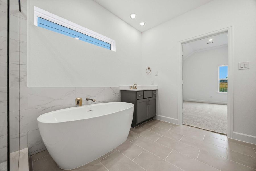 Retreat to a sanctuary of elegance with a freestanding tub and a refreshing step-in shower. Pamper yourself every day.
