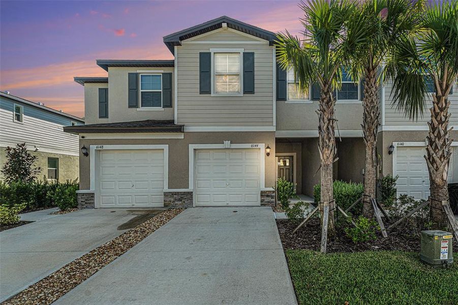 Front exterior of a new home in , Land O' Lakes, FL, highlighting curb appeal (Image 2). Front exterior of a new home in , Land O' Lakes, FL, highlighting curb appeal (Image 2).