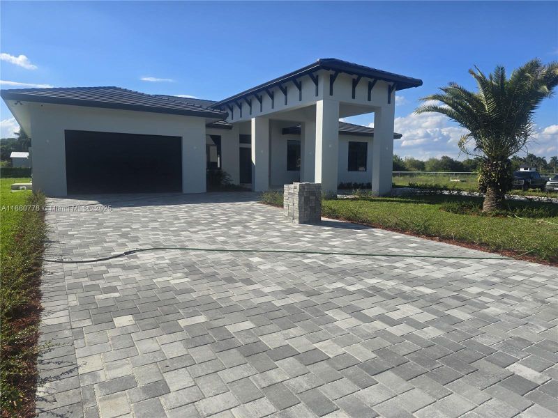 Front exterior of a new home in , Homestead, FL, highlighting curb appeal (Image 41).