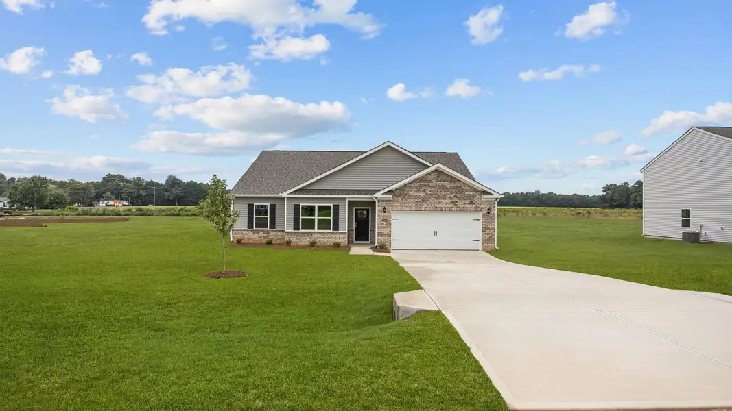Front exterior of a new home in Beaver Dam Crossing, Bailey, NC, highlighting curb appeal (Image 2). Front exterior of a new home in Beaver Dam Crossing, Bailey, NC, highlighting curb appeal (Image 2).