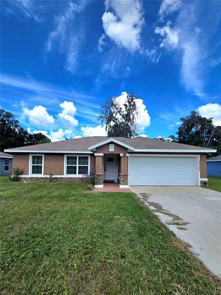 Front exterior of a new home in , Belleview, FL, highlighting curb appeal (Image 2). Front exterior of a new home in , Belleview, FL, highlighting curb appeal (Image 2).