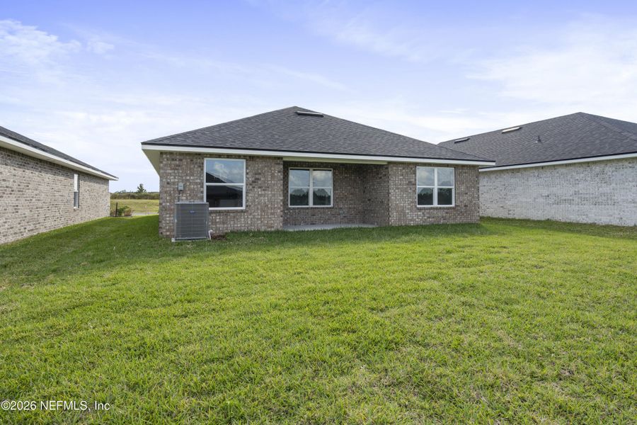 Exterior details and patio area of a home in Shadow Crest at Rolling Hills, Green Cove Springs (Image 3).